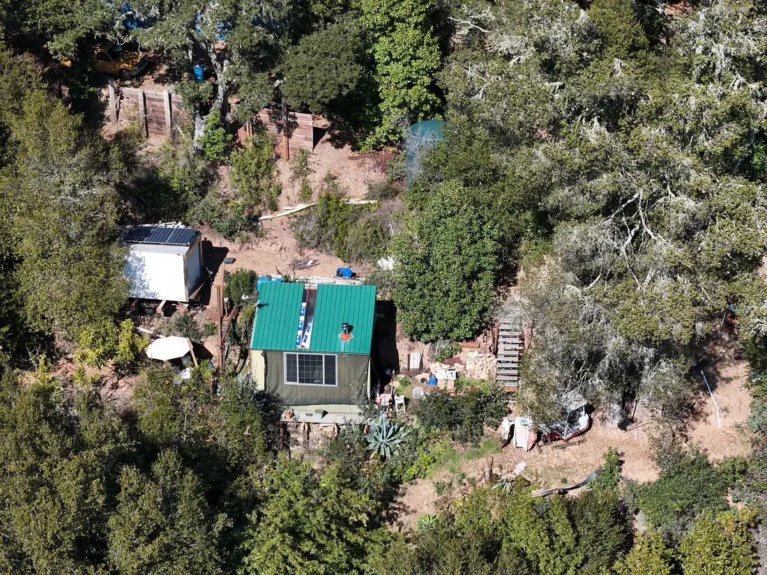 Aerial view of the graded private drive switchbacking up the mountainside